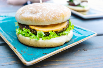 Cheese burger - American cheese burger with fresh salad