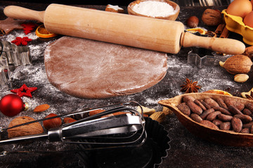 Baking christmas cookies. Typical cinnamon stars bakery with spices. xmas decoration on table