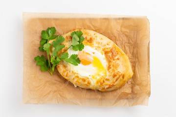 Adjarian khachapuri with egg yolk and cheese isolated on white background