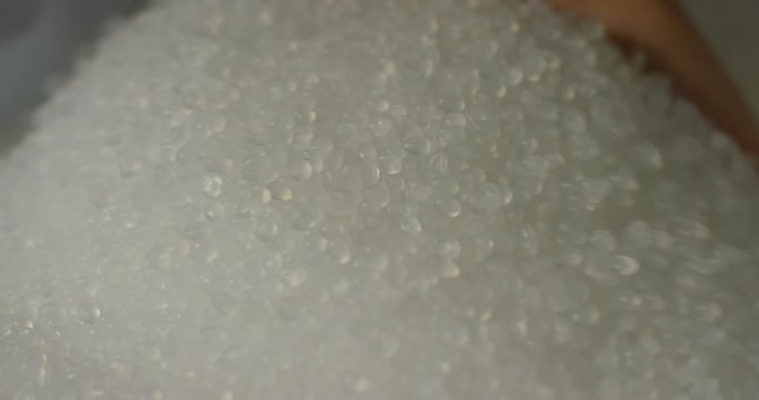 Granular plastic in the bag, slow motion