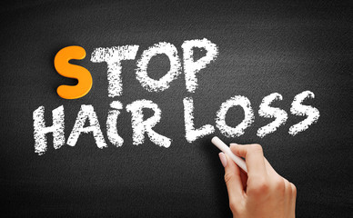 Stop Hair Loss text on blackboard