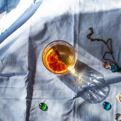 aperol spritz cocktail on table, strong summer light