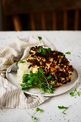 Cauliflower steak with mashed cauliflower with herbs