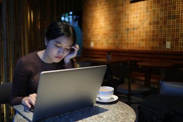 Feeling tired and stressed. Royalty high-quality free stock photo image of young and beautiful asian businesswoman stress with tired eyes, headache, feeling fatigue, overloaded with computer work late