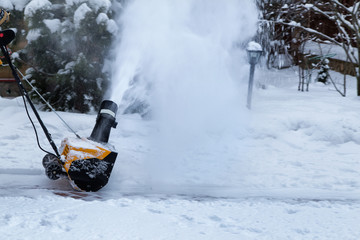 Snowblower in operation.Snowy winter yard. Snow blower isolated.