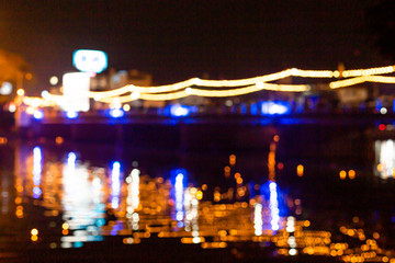 Background images,Blur of bridges and reflections of lights in the center of Chiang Mai, Thailand
