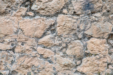Old stone rock wall background texture. 