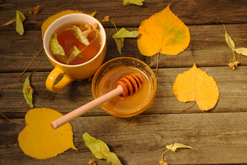 Linden flowers isolated on wood background.