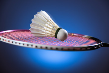 Badminton racket and shuttlecock  in motion closeup