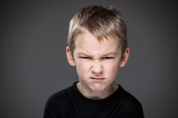 Loads of aggression in a little boy - education concept hinting behavioral problems in young...