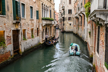 Fototapeta na wymiar 09.10.2019 Venice, Italy, Motor boat in the turquoise channel.
