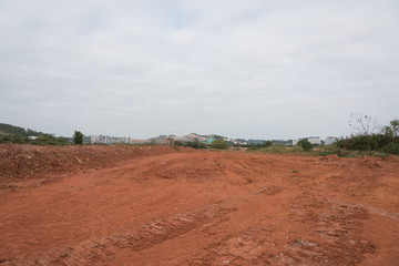 Fototapeta na wymiar Landscape view of dirt road surface of construction development site