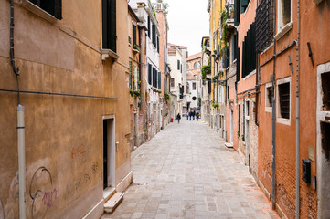09.10.2019 Venice, Italy, Old shabby streets with walking tourists