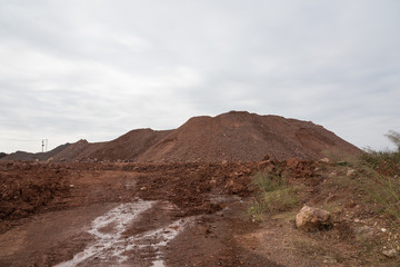 Close-up landscape view of towering stacked sand in large quarry