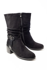 women's black demi-season leather boots on white background