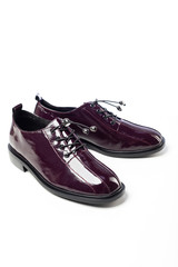 women's patent high-heeled shoes on white background