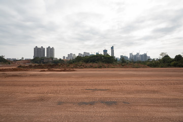 Fototapeta na wymiar City building dirt road horizon road landscape