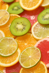 Fototapeta na wymiar Fruit Background With Lemon, Kiwi, Orange, Tangerine