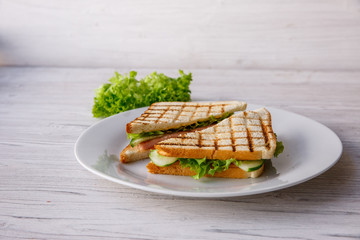 Club sandwich on wooden table