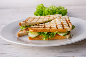 Club sandwich on wooden table