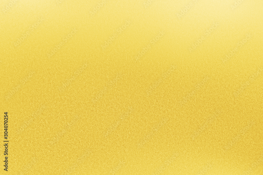 Sticker gold texture background. golden wall surface reflection