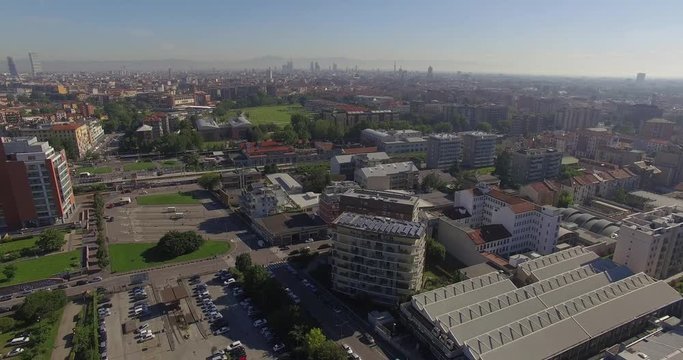Milan, Italy. A slow flight towards the center of Milan. Shot in the district of Romolo south of the city.