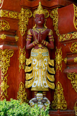 Statue in garden at Wat Ming Mueang, Chiang Rai, Thailand