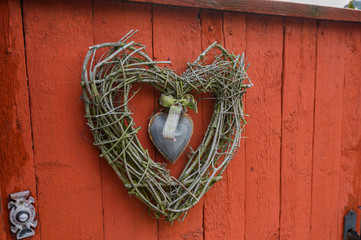 Decorative decoration wreath in the shape of a heart of branches. Porvoo, Finland.