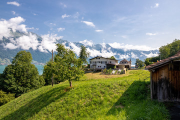 Fototapeta na wymiar The local Swiss houses with Alps landscape , Switzerland