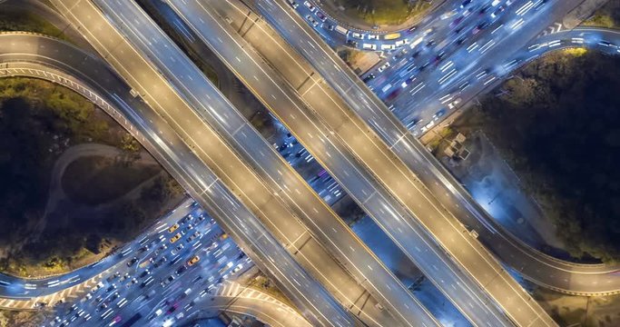 aerial top view traffic road roundabout in city at night, Time lapse top road in bangkok.