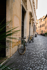 Vintage Bicycle parked on a cobblestone street. Italy, Rome.
