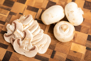 Cut mushrooms on a wooden cutting board