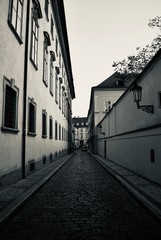 Black and white image of a shabby street in Prague