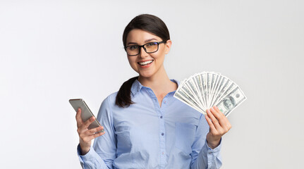 Businesswoman Holding Phone And Money Standing On White Background, Panorama