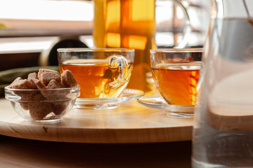 Hot refreshing citrus tea in glass close up