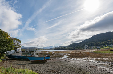 View across the bay affectionately called the Lovely Muck in Portree on the Isle of Skye in Scotland 