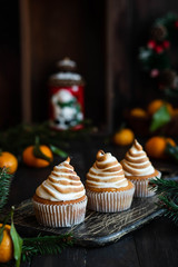 Citrus cupcakes with lemon curls and a cap from Swiss meringue