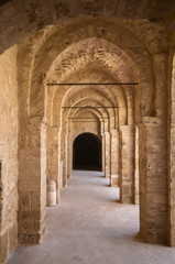 Fototapeta na wymiar Stone arches in the corridor of Ribat Citadel, Sousse, Tunisia.