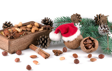 Wooden box with mixed nuts isolated on white. Christmas set.