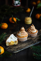 Citrus cupcakes with lemon curls and a cap from Swiss meringue