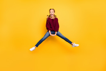Fototapeta na wymiar Full length body size view of her she nice attractive overjoyed cheerful cheery playful pre-teen girl having fun jumping holiday weekend isolated on bright vivid shine vibrant yellow color background