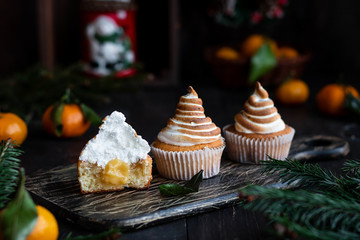 Citrus cupcakes with lemon curls and a cap from Swiss meringue