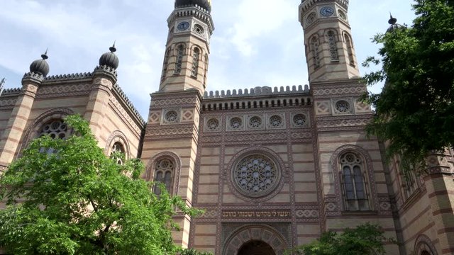 tilt down clip of the front entrance to the historic great synagogue in budapest, hungary