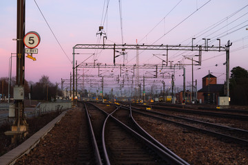 Fototapeta na wymiar Railway yard at beautiful sunset background in Kouvola, Finland.