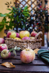ripe red apples on rustic wooden background