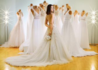 bride in the bridal salon, the dress looks for