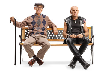 Senior man with a cane and a punk man sitting on a bench