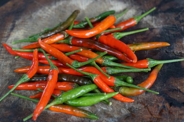 Red and green peppers, emphasizing the selection of pepper, colorful organic food ingredients used as background