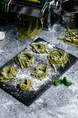  Spinach green pasta on a black slate plate