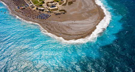 beautiful arc of the coastline with turquoise colored sea and clear water, sandy beach, view from...